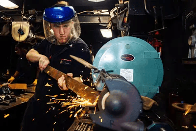 Hand grinding metal part